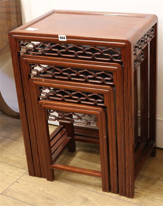 A Chinese nest of padouk tables, H.69cm